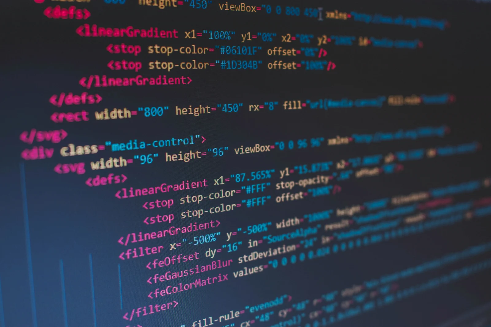 Source code on a dark editor, representing production agent architecture